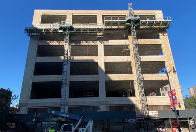 Commercial building masonry conversion with scaffolding